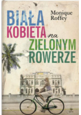 Biała kobieta na zielonym rowerze