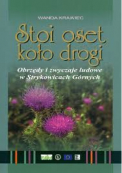 Krawiec stoi oset koło drogi
